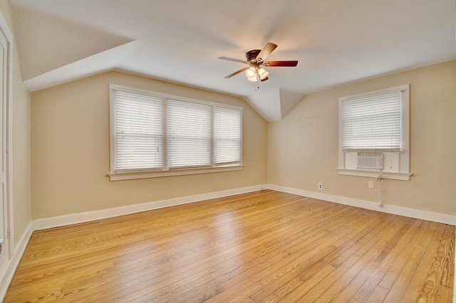 additional living space featuring ceiling fan, light wood finished floors, lofted ceiling, and baseboards