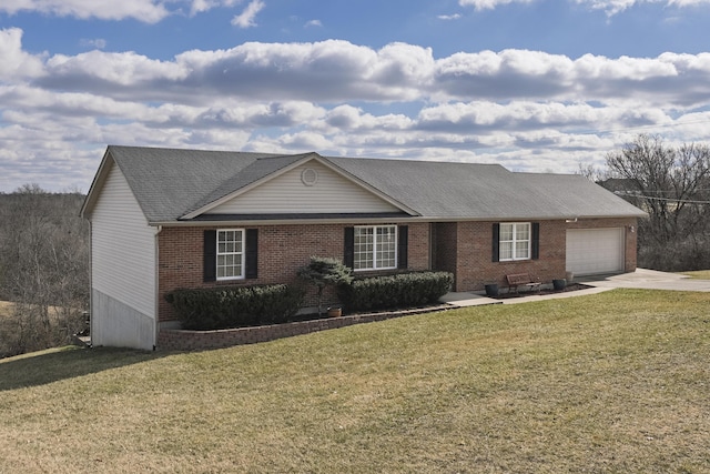 ranch-style house featuring driveway, a garage, a front lawn, and brick siding