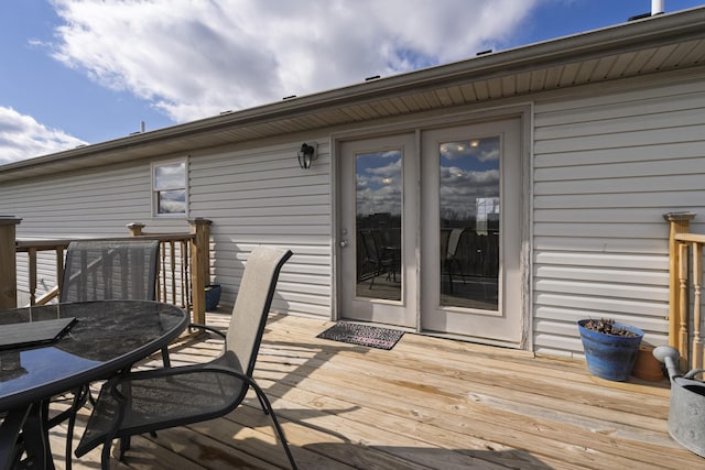 wooden deck featuring outdoor dining area