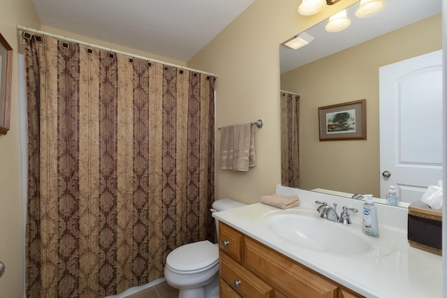 full bath with vanity, toilet, and tile patterned floors