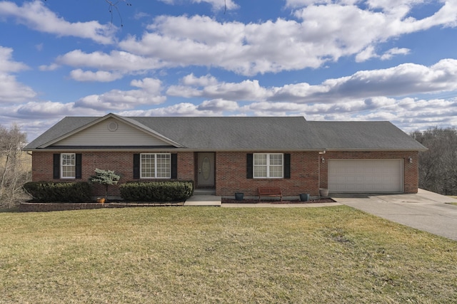 single story home with a garage, a front lawn, concrete driveway, and brick siding