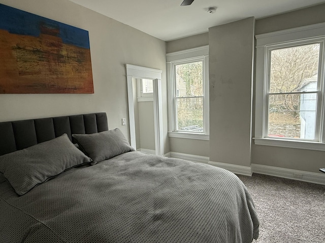 carpeted bedroom with baseboards