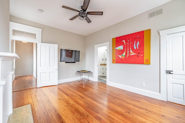 639 Watkins St, Covington, KY 41011 - unfurnished living room featuring a ceiling fan and light wood-style flooring