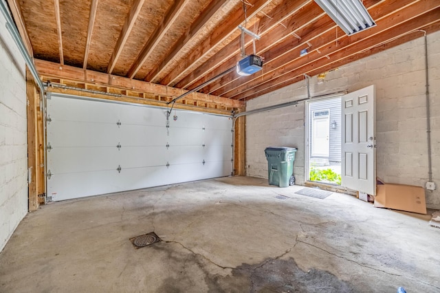 639 Watkins St, Covington, KY 41011 - garage with a garage door opener and concrete block wall