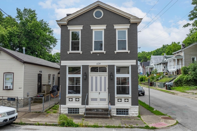 639 Watkins St, Covington, KY 41011 - shotgun-style home featuring entry steps and brick siding