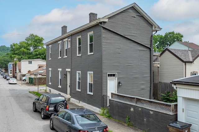 639 Watkins St, Covington, KY 41011 - view of side of home featuring a chimney