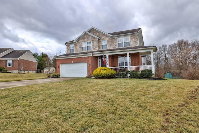 view of front of property featuring concrete driveway, stone siding, covered porch, a front lawn, and brick siding