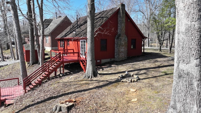 view of property exterior featuring stairs and crawl space