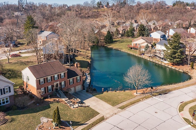 birds eye view of property featuring a residential view and a water view