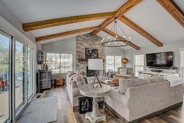 living area with hardwood / wood-style floors, vaulted ceiling with beams, a fireplace, and a chandelier