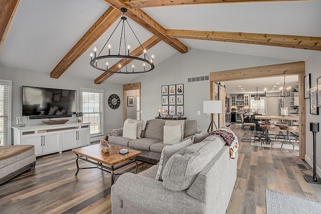 living room with visible vents, a notable chandelier, beamed ceiling, and dark wood finished floors