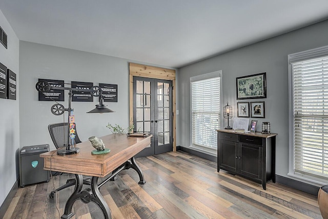 office space featuring wood finished floors and french doors