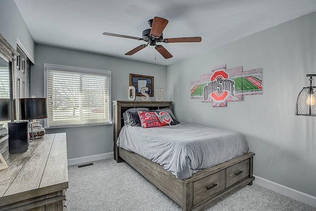 bedroom featuring visible vents, carpet flooring, and baseboards