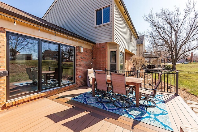 deck with outdoor dining space