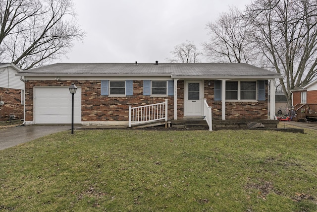 ranch-style house with aphalt driveway, an attached garage, brick siding, and a front yard