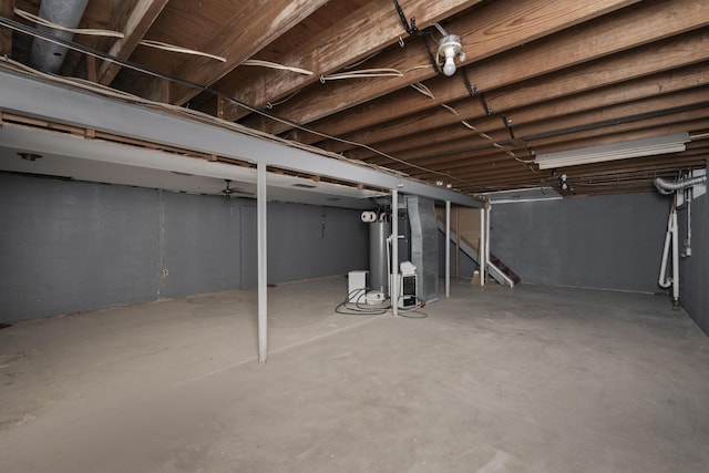 unfinished basement with gas water heater