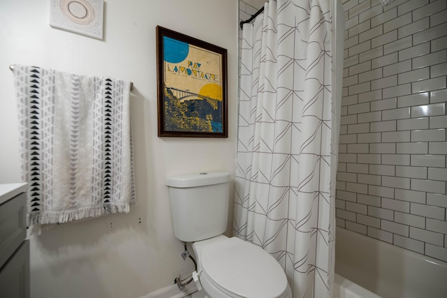 full bathroom with shower / bath combo with shower curtain, toilet, and vanity