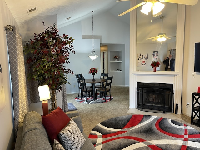 carpeted living area featuring visible vents, baseboards, a fireplace with flush hearth, built in shelves, and high vaulted ceiling