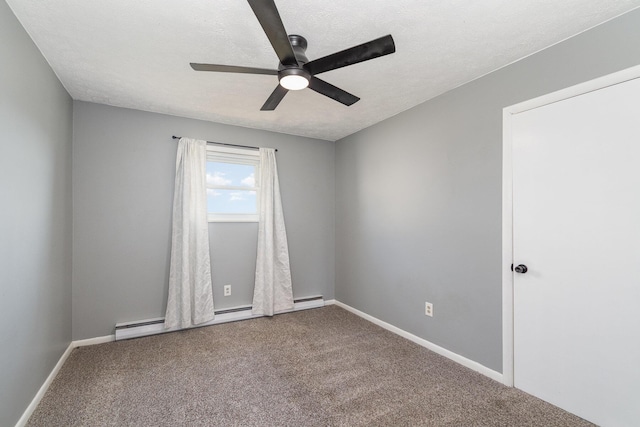 carpeted spare room with a textured ceiling, a ceiling fan, baseboards, and a baseboard radiator