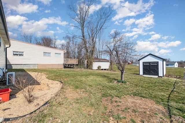 view of yard with a storage shed and an outdoor structure