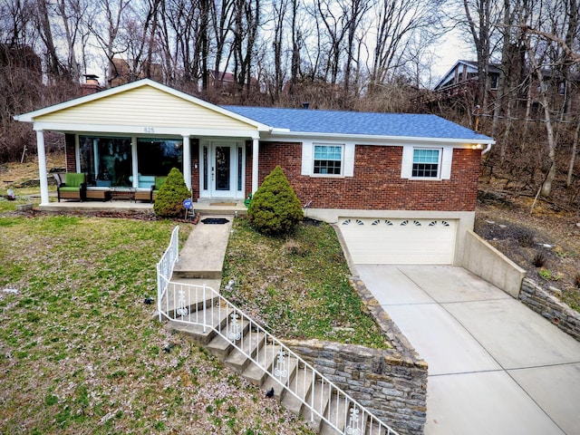 single story home with brick siding, roof with shingles, concrete driveway, a front yard, and a garage