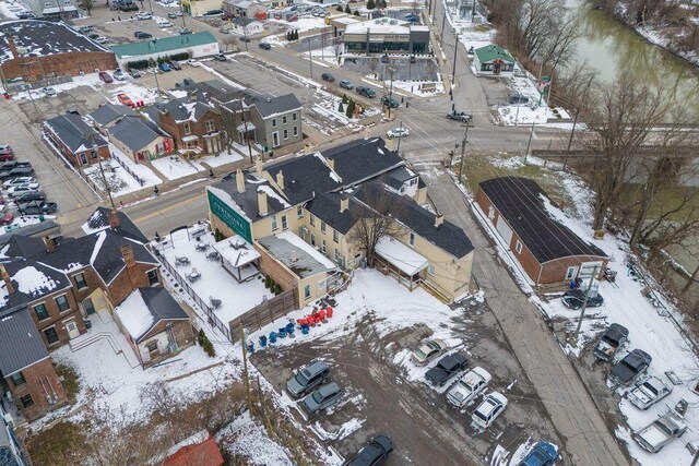 snowy aerial view featuring a residential view