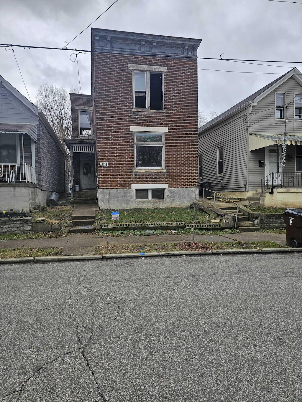 view of front of house featuring brick siding