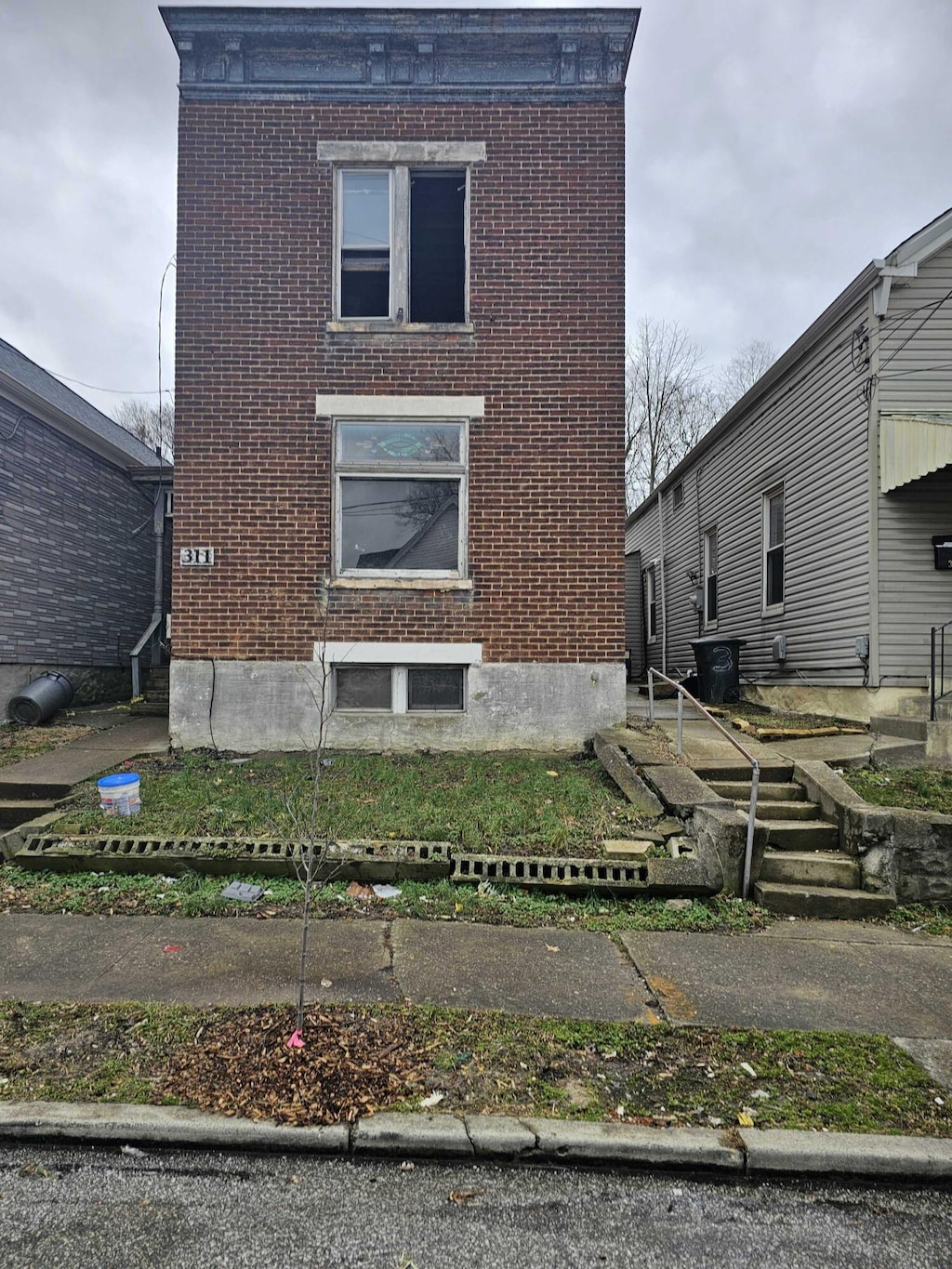 view of side of home with brick siding