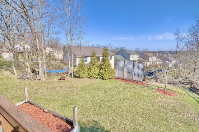 view of yard featuring a residential view