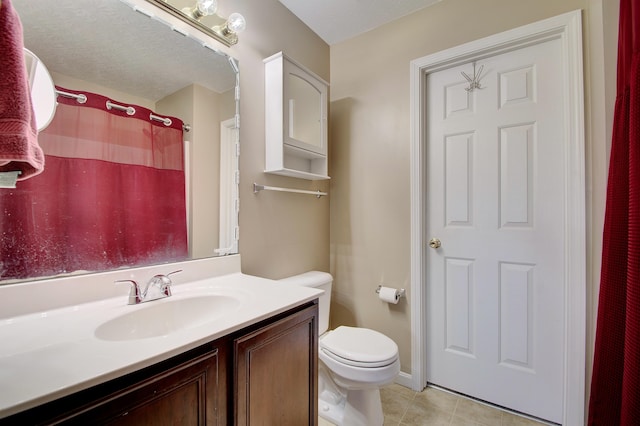 bathroom with vanity, curtained shower, toilet, and tile patterned flooring