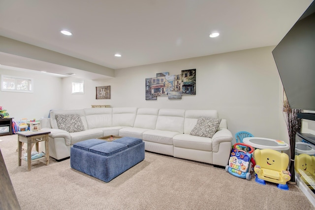 living area featuring recessed lighting and carpet