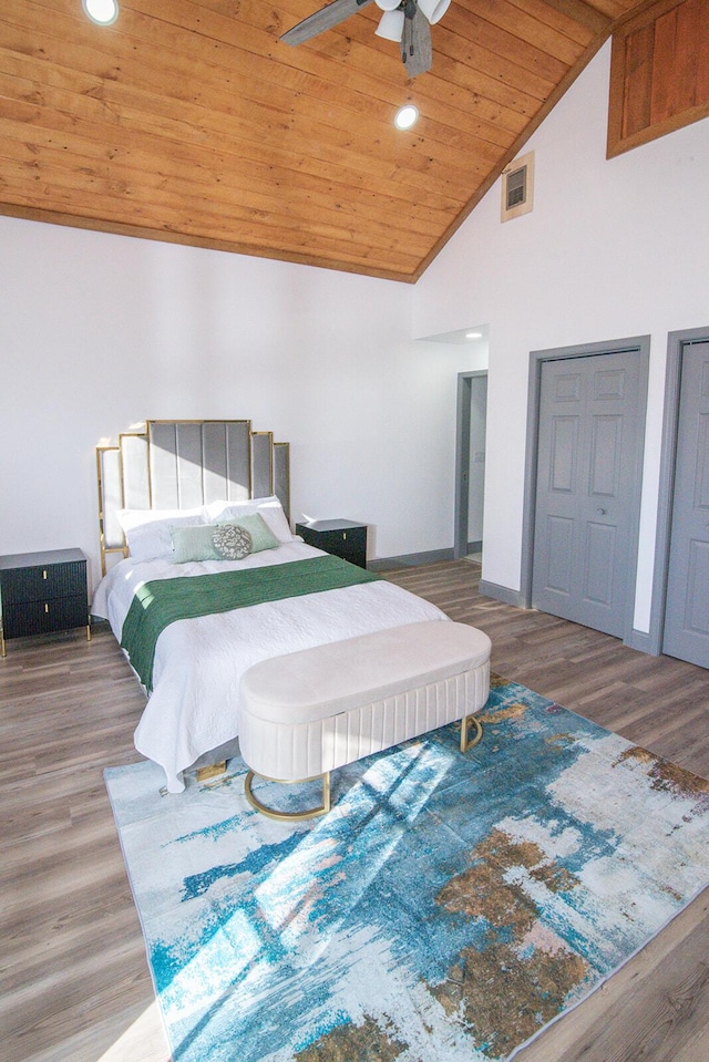 bedroom featuring visible vents, wood ceiling, wood finished floors, high vaulted ceiling, and recessed lighting