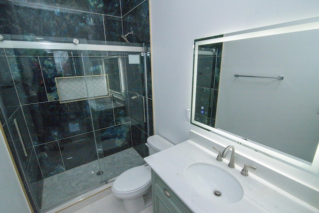 bathroom featuring a stall shower, vanity, and toilet