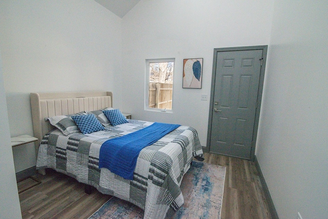 bedroom featuring vaulted ceiling and wood finished floors