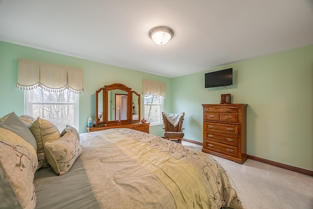 carpeted bedroom with baseboards