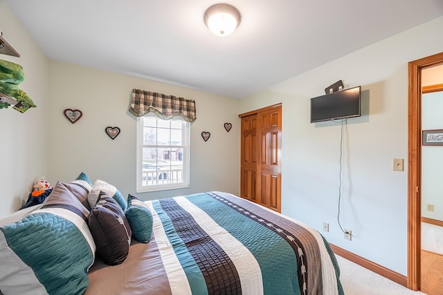 bedroom featuring baseboards and carpet flooring