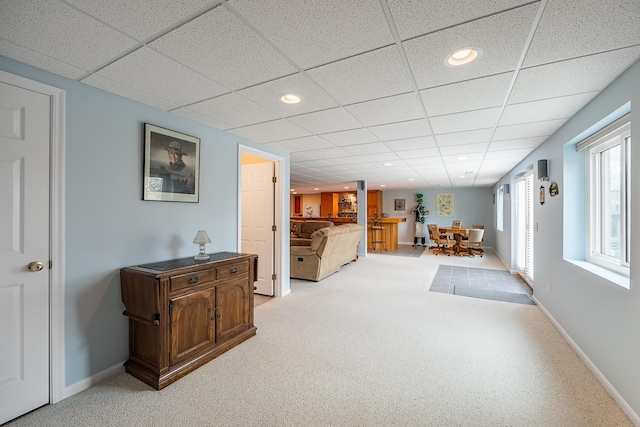 interior space featuring baseboards, recessed lighting, and light colored carpet