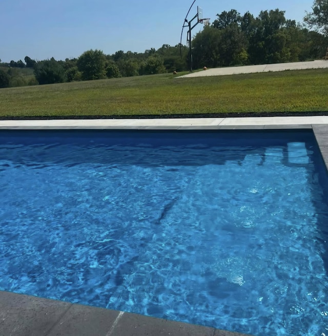 pool featuring a lawn
