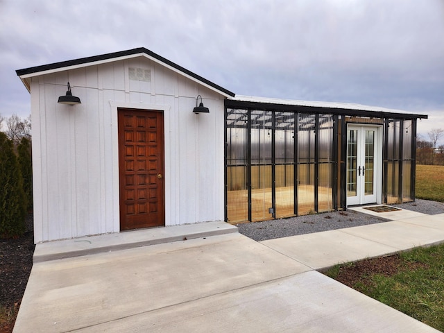 view of outdoor structure with an outbuilding and french doors