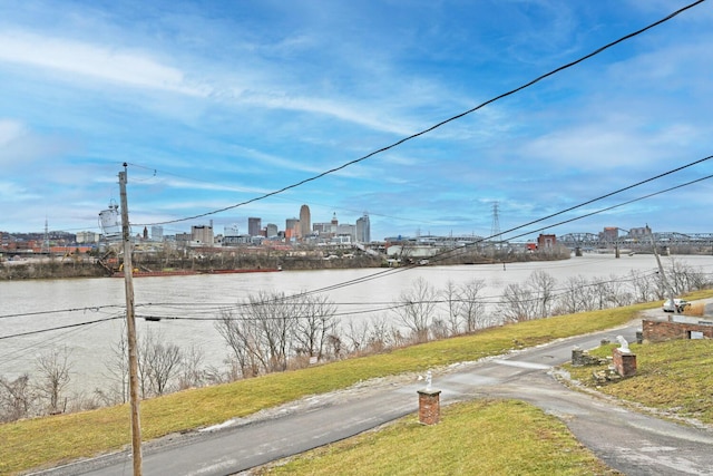 view of street featuring a water view and a view of city