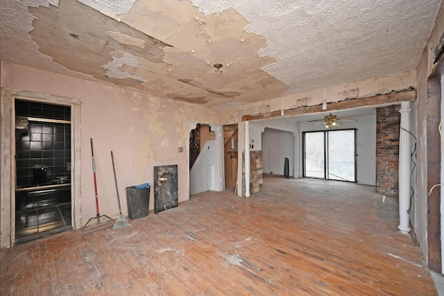 empty room with hardwood / wood-style flooring and ceiling fan