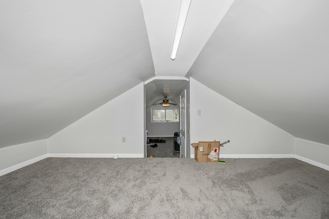 bonus room with vaulted ceiling, carpet, and baseboards