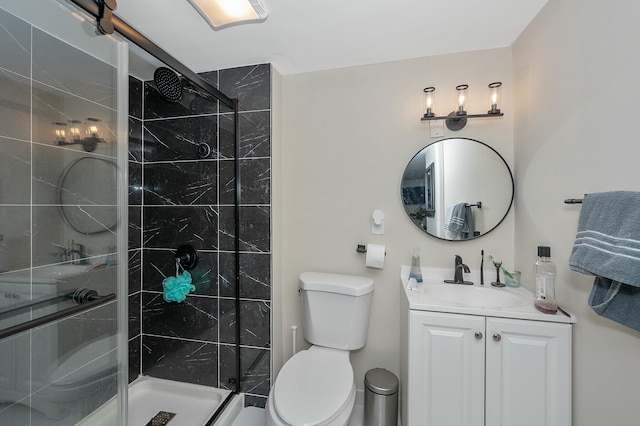 full bath with a shower stall, toilet, and vanity