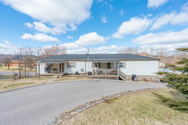 single story home featuring covered porch