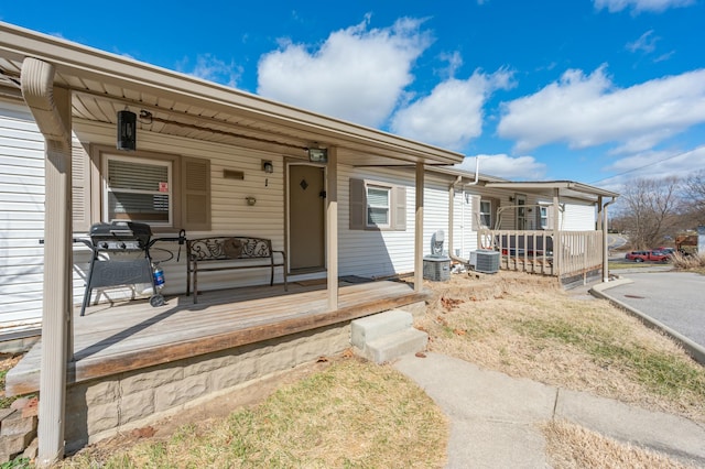 view of front of property featuring a porch and central AC