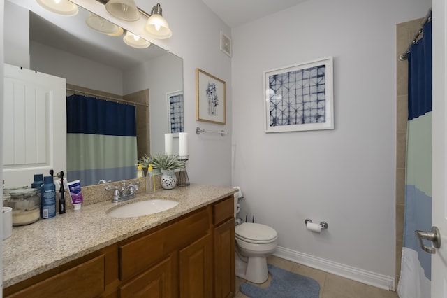 bathroom featuring visible vents, toilet, vanity, baseboards, and tile patterned floors