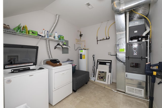 laundry room featuring laundry area, visible vents, washer and dryer, and electric water heater