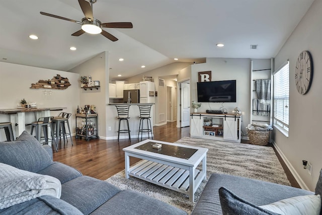 living area featuring recessed lighting, dark wood-type flooring, baseboards, and vaulted ceiling