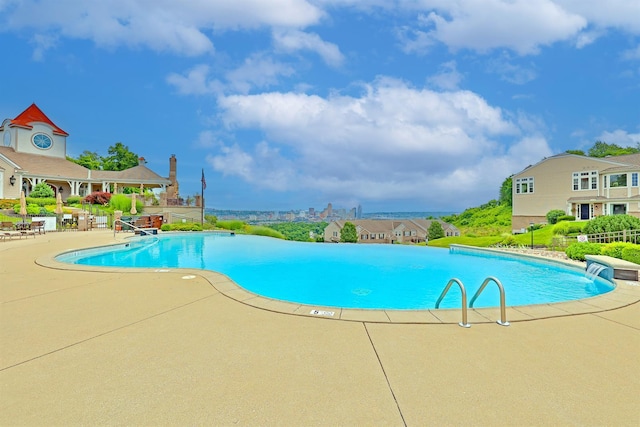 community pool featuring a patio area