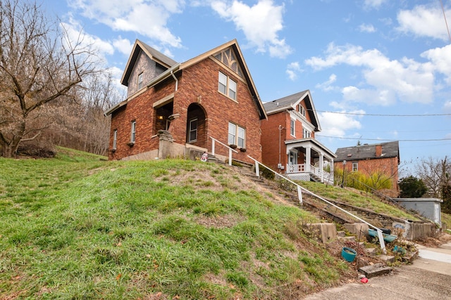 view of front of house with brick siding